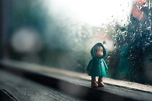 Support for Parents. figure on sill with rain